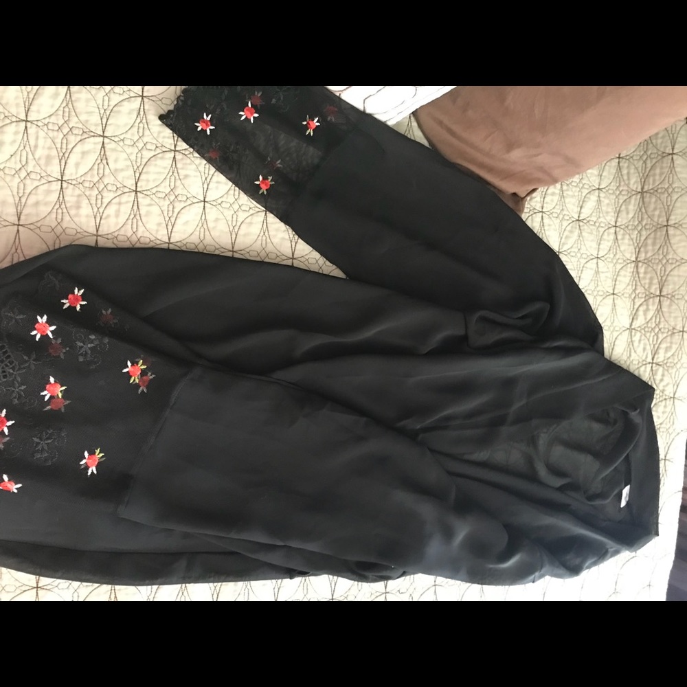 Black kimono . Floral accents on hand openings